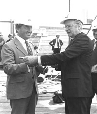 Arts Minister Norman Lacy, with General Manager George Fairfax, preparing to install the lightning conductor to the spire of the Victorian Arts Centre on 20th October 1981 to complete its construction. George Fairfax with Norman Lacy.jpg