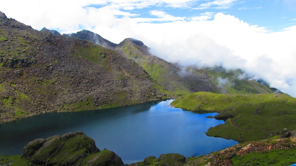 A nice view of Gosaikunda(an alpine freshwater oligotrophic lake) situated at Langtang National Park, Rasuwa, Nepal located at an altitude of 4,380 m (14,370 ft) in the Rasuwa District with a surface of 13.8 ha (34 acres). नेपालको रसुवा स्थित लाङटाङ राष्ट्रिय निकुञ्जको क्षेत्रमा रहेको गोसाइँकुण्डको एक मनोरम दृश्य । ©Sherparinji