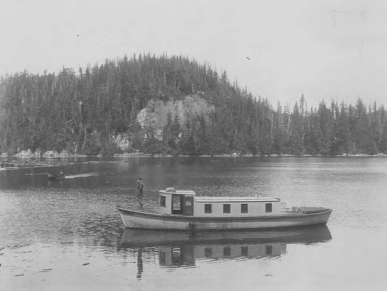 File:Small boat, canoe and log boom viewed from the landing on Surveyed Timber Limit 2001, looking towards Clark and Lyford, Ltd Camp (AL+CA 7788).jpg