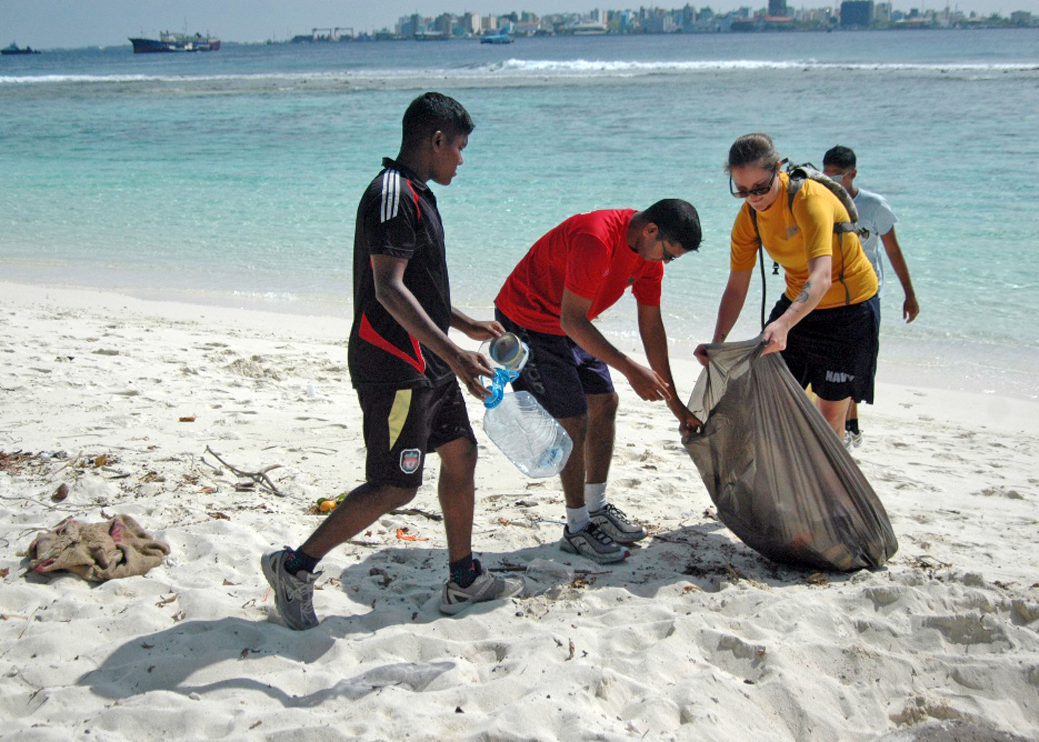 Beach clean up. Clean up the Sea. Helloween in Australia on the Beach Beach. Clean Beach slogan.