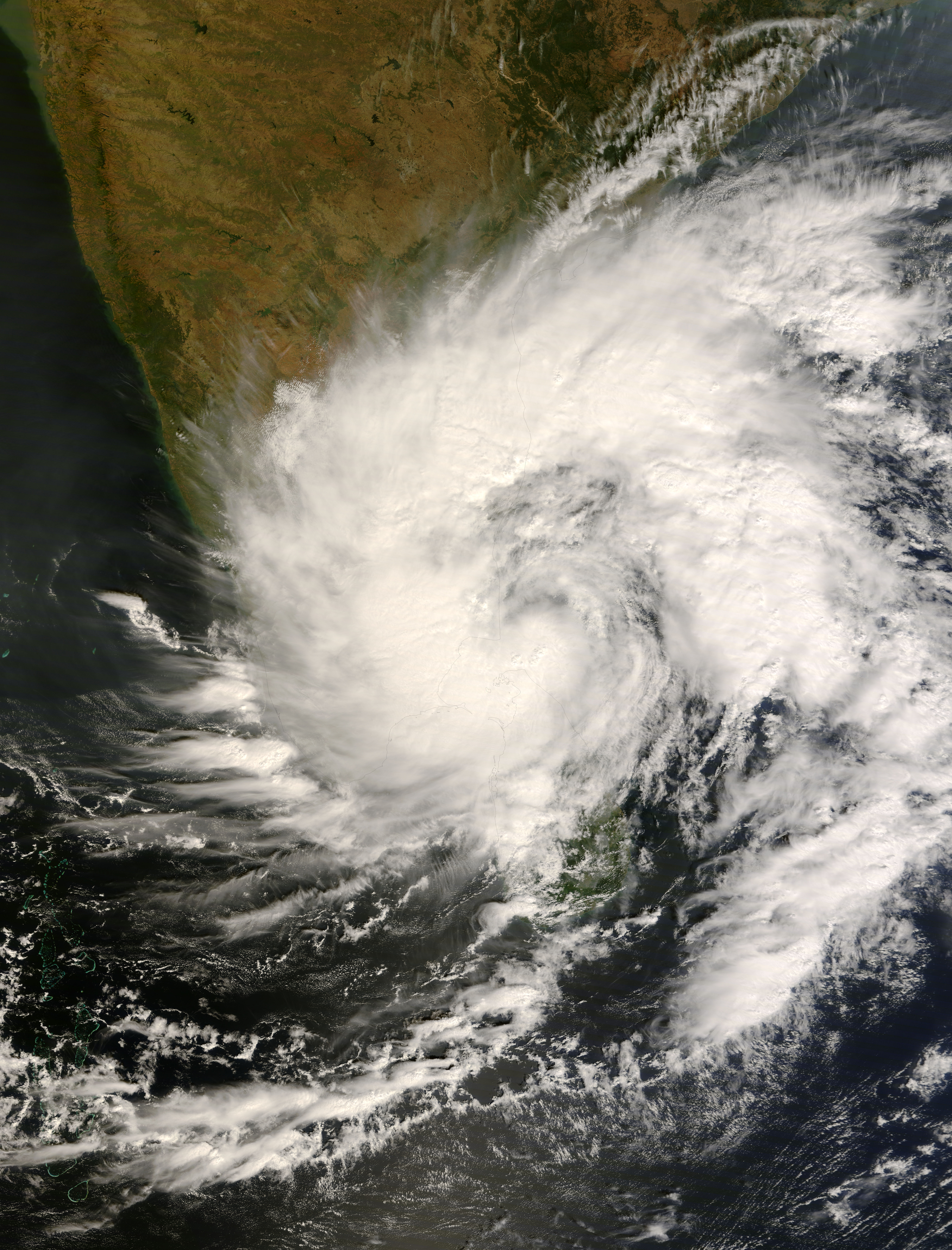Cyclone Nisha strikes northern Sri Lanka, killing 15 people and displacing 90,000 others while dealing the region the highest rainfall in nine decades.