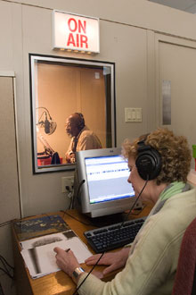 A narrator and monitor record a digital-audio book, or "talking book" for the Perkins Braille and Talking Book Library BTBL recording studio.jpg