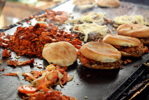 Tortas being prepared on a griddle in Oaxaca, Mexico