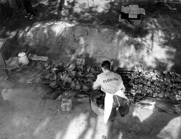 File:A cook preparing ribs and chicken for barbecue during the Kissimmee River boat-a-cade- Kissimmee River, Florida (4863555280).jpg