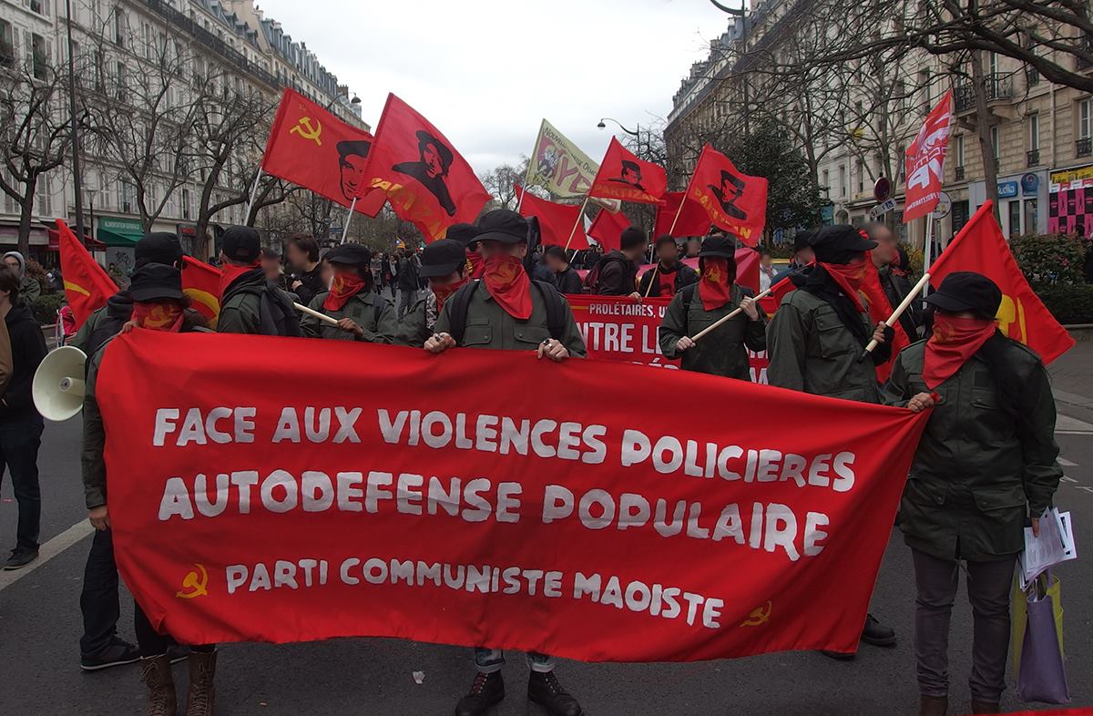 PCM Marche pour la justice et la dignité.jpg English: Activists of the PCM walking in the Marche pour la justice et la dignité in Paris, March