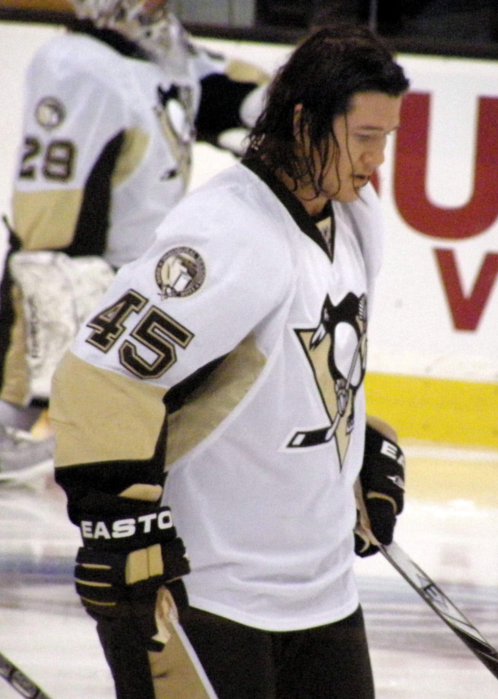 Arron Asham of the Pittsburgh Penguins throws T-shirts into the