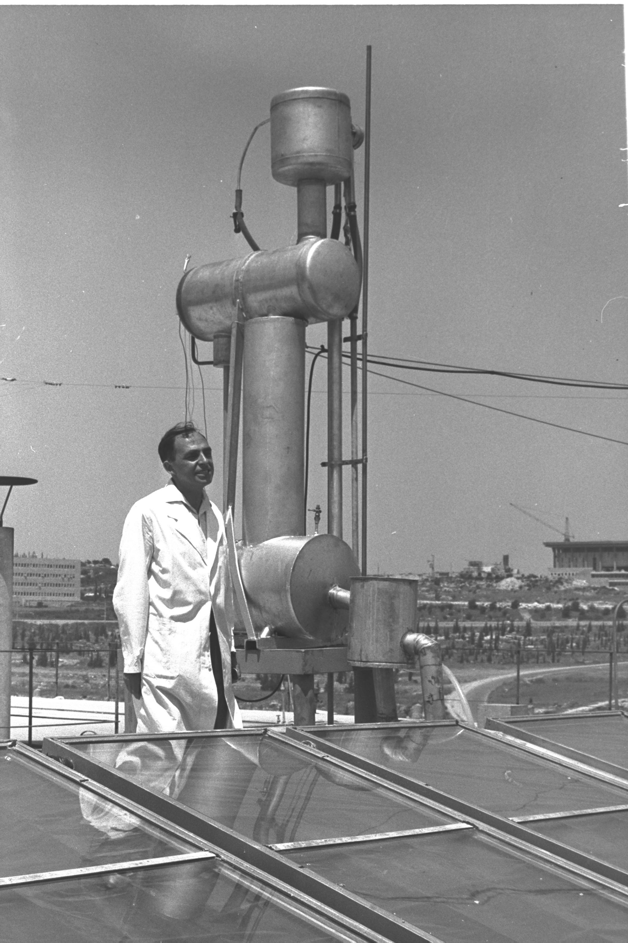 Zvi Tabor and Solar hot water panels.jpg