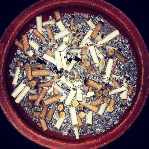 Ashtray full of Cigarette butts.png