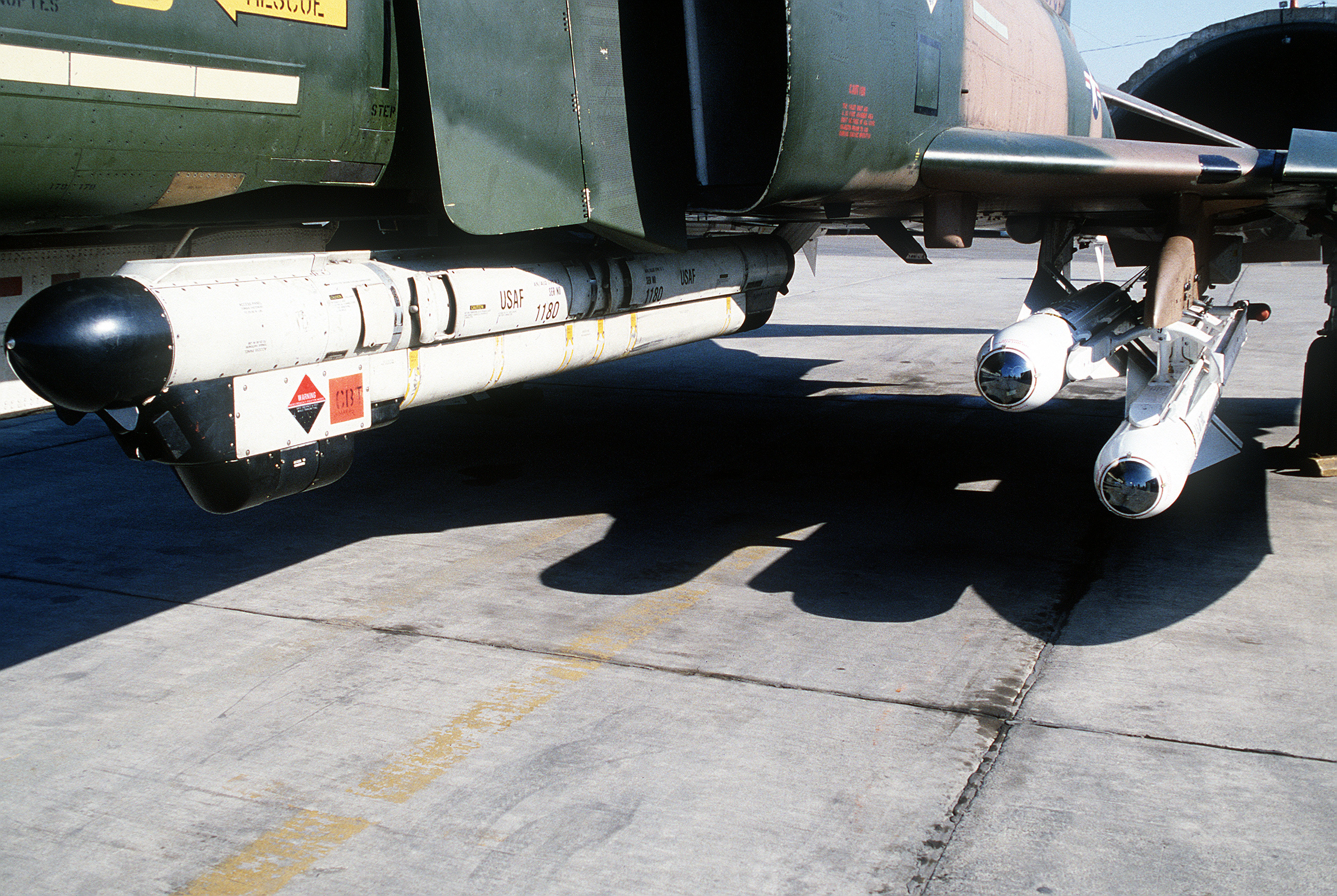 F-4E_with_ALQ-119_pod_and_AGM-65s_1982.JPEG