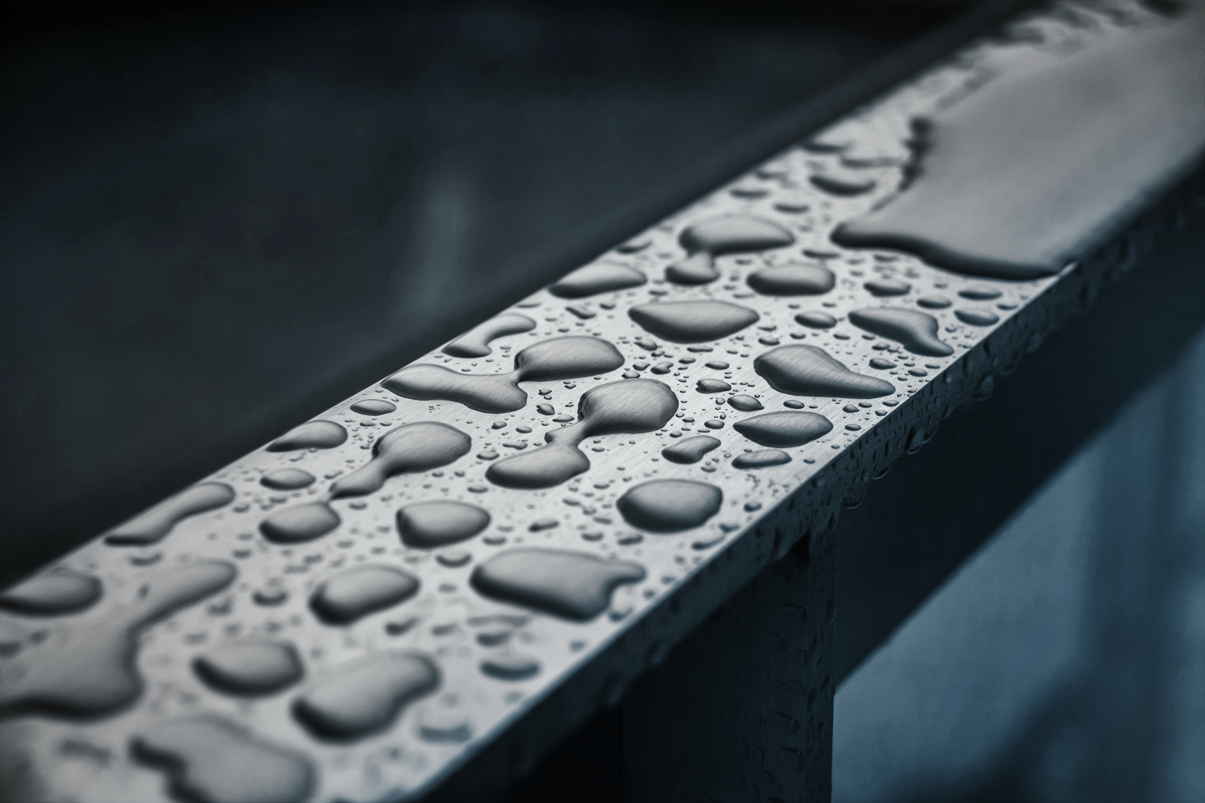 Raindrops on a railing. WikiCommons Juanedc