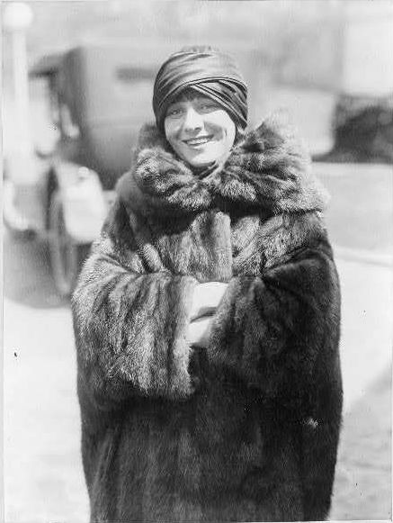 Fur Coat. circa 1929: A fashion model wearing a fur coat