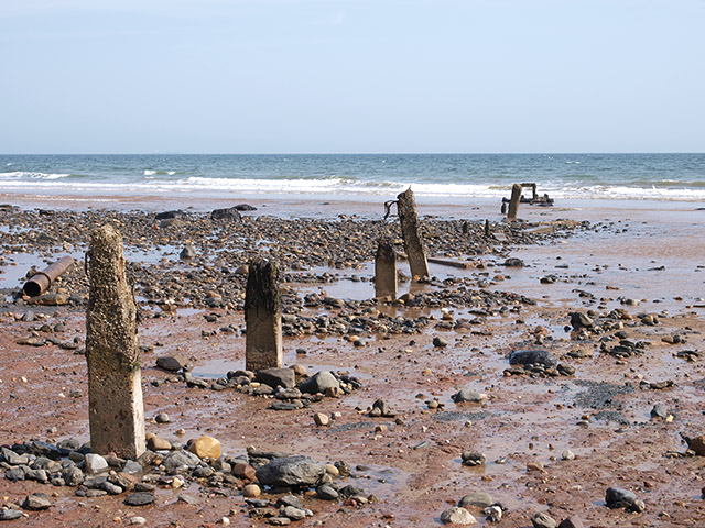 File:Posts on the beach - geograph.org.uk - 795382.jpg