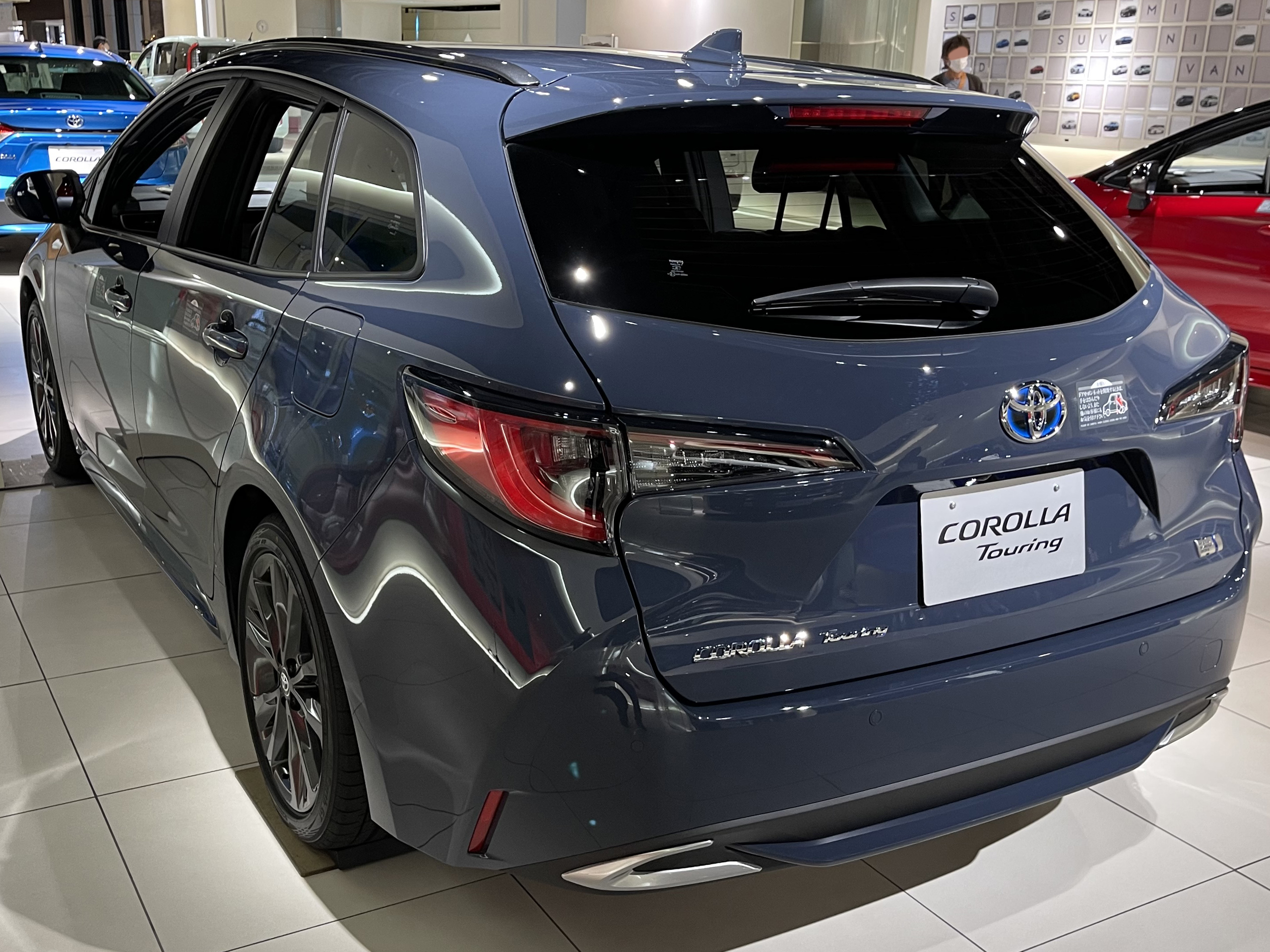 File:Toyota COROLLA Touring HYBRID W×B E-Four (6AA-ZWE215W-AWXSB