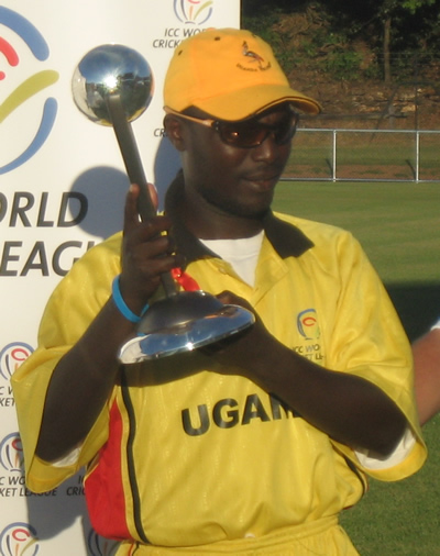 Winning Captain Joel Olweny proudly displays the trophy after Uganda's victory