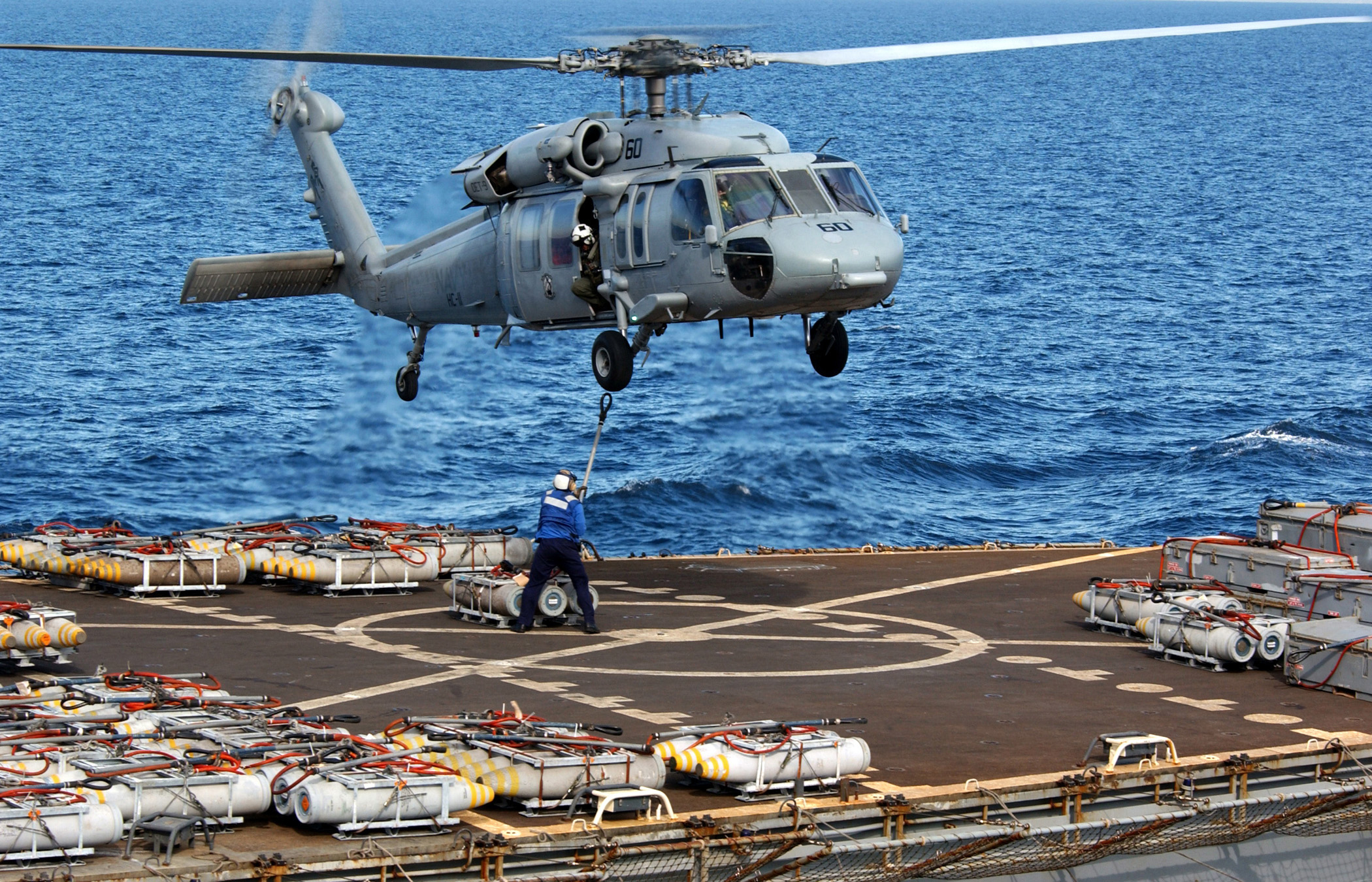 File Us Navy N 7130b 091 An Mh 60s Knighthawk Helicopter Prepares To Receive And Transport Ordnance From The Military Sealift Command Ammunition Ship Usns Flint T Ae 32 To Uss Ronald Reagan Cvn 76 Jpg Wikimedia