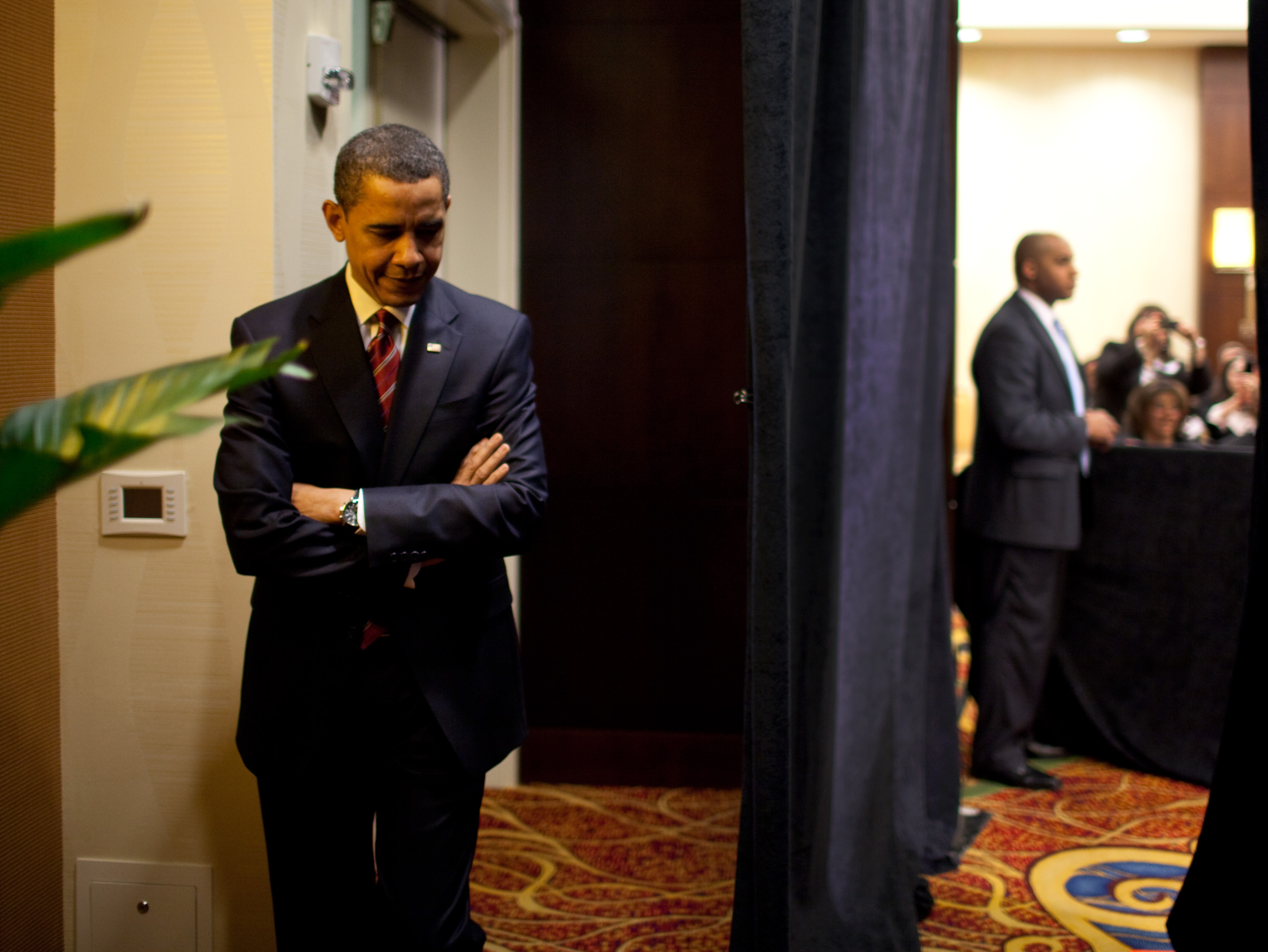 Barack Obama waits to speak to Hispanic Chamber of Commerce 3-10-09