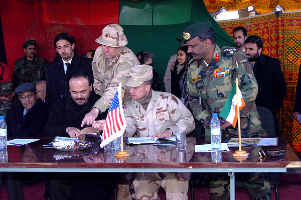 File:U.S. Army Maj. Scott Stewart points to the signature block for Baz Mohammed Jawhari of the Afghan Ministry of Defense as U.S. Col. Len Shartzer and Indian military attache Gen. Nair Balakrishnah look on.jpg