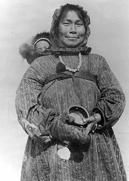 File:Kingikmiut Eskimo woman with chin tattoo carrying baby on her back and holding wooden bowl, Cape Prince of Wales, Alaska (AL+CA 2261).jpg