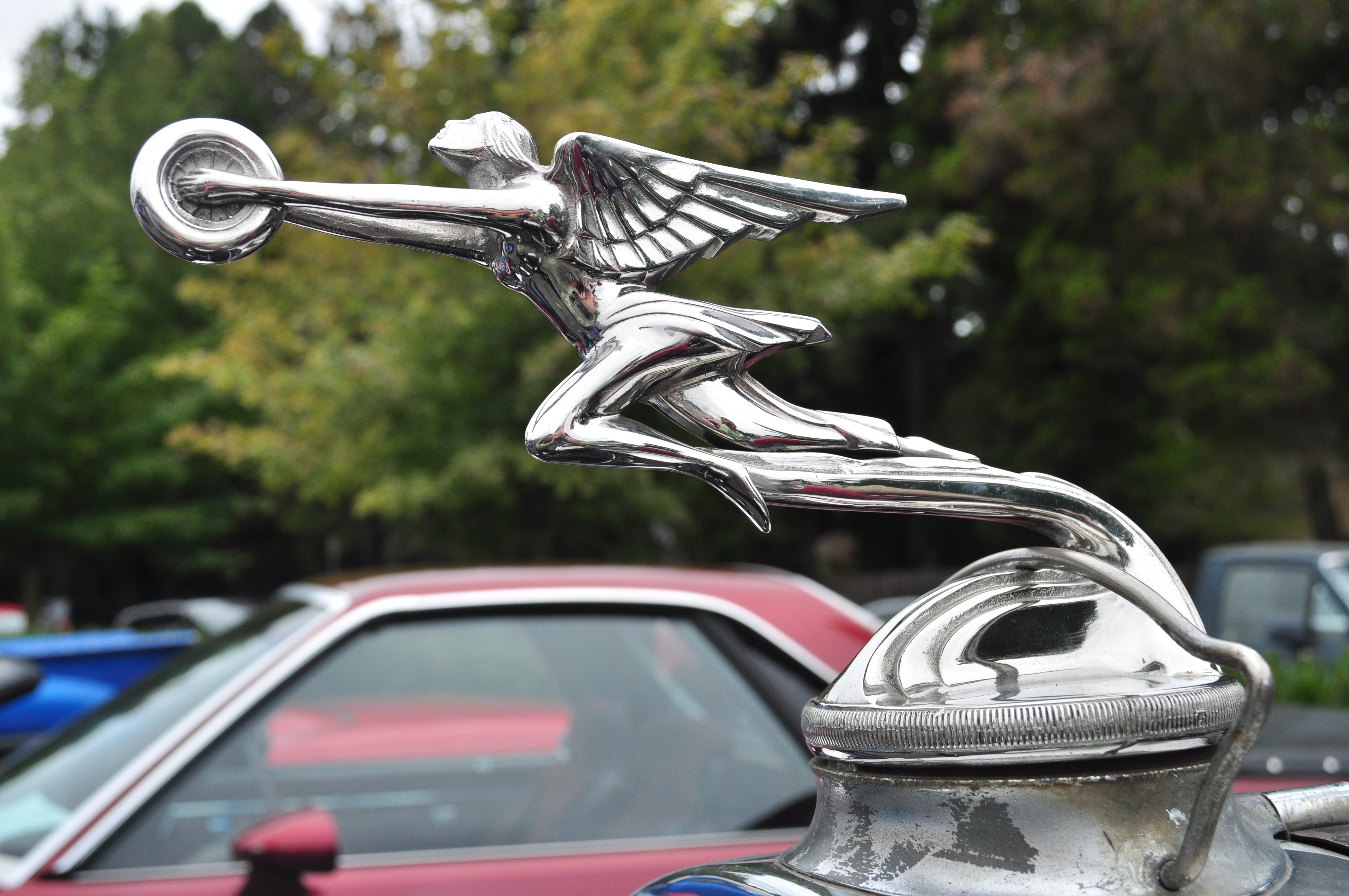 Packard эмблема на капоте
