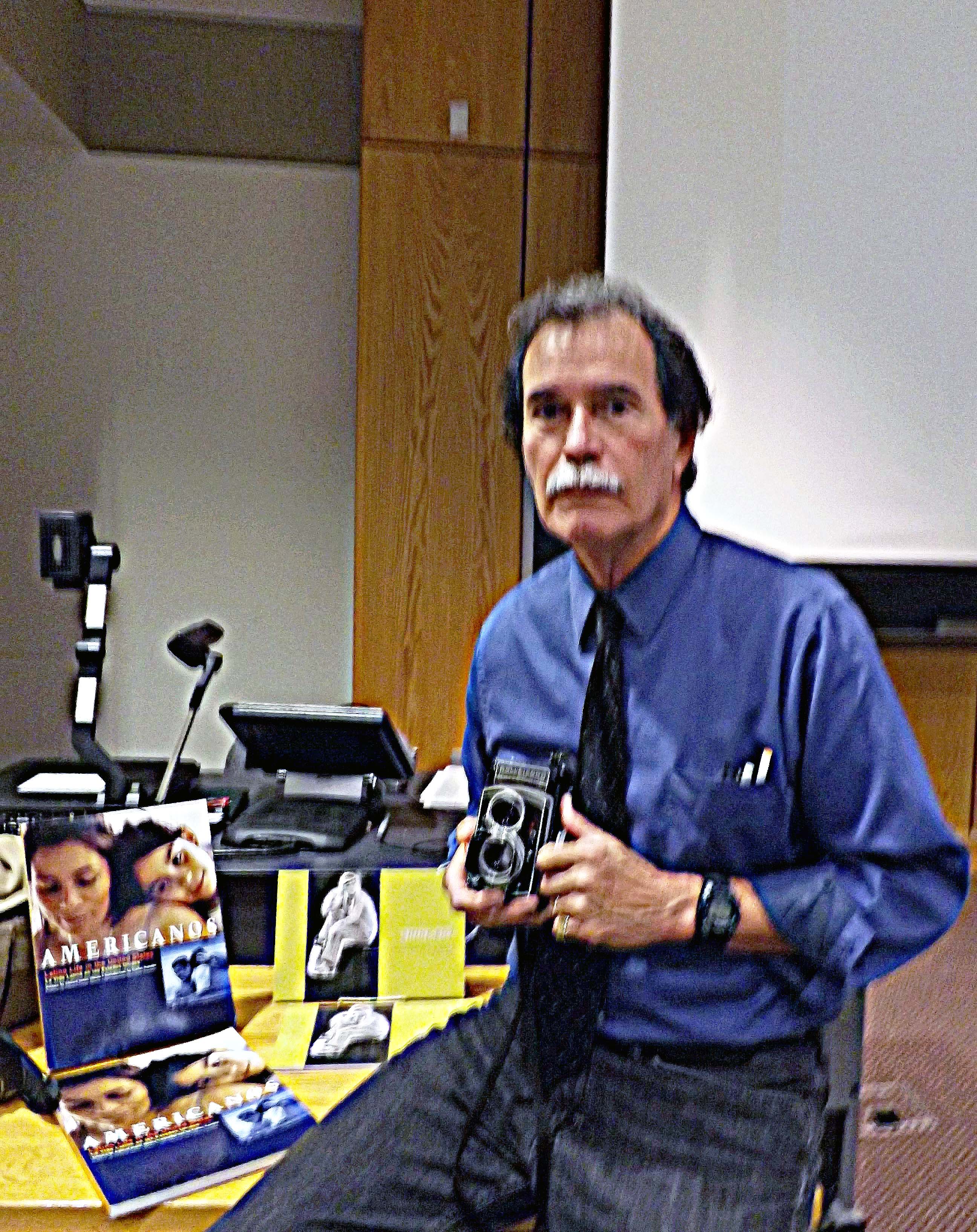 José Galvez with his camera, equipment and books.