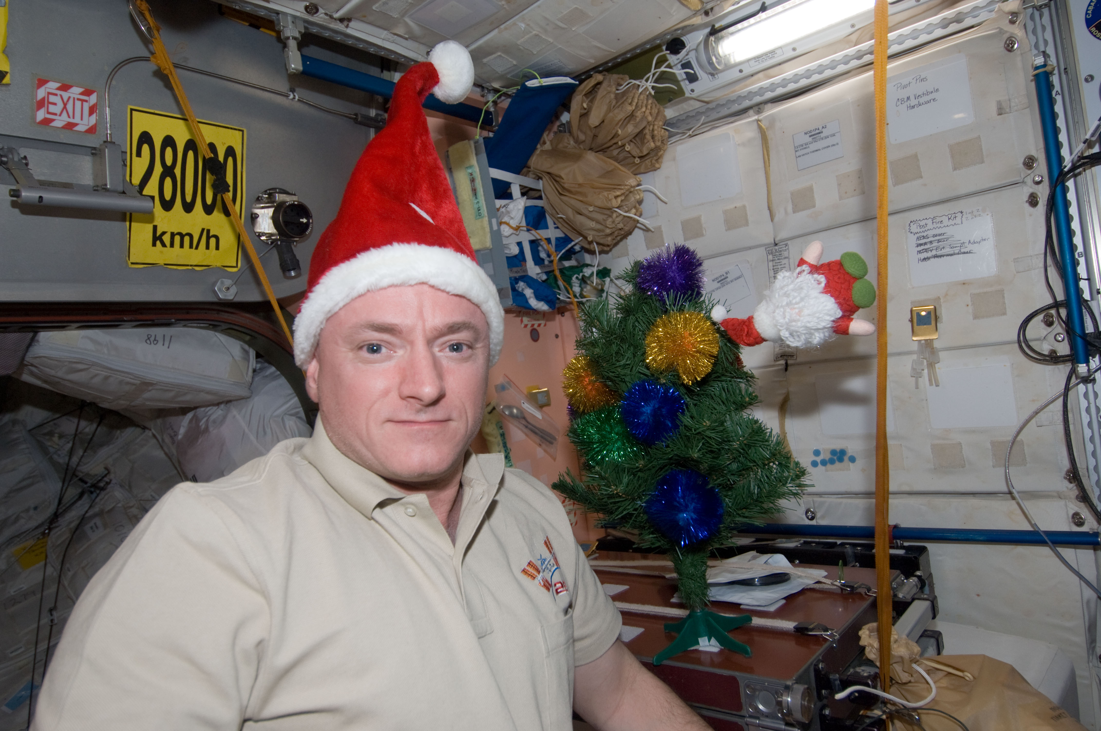 ISS-26_Scott_Kelly_with_Santa_Claus_hat.