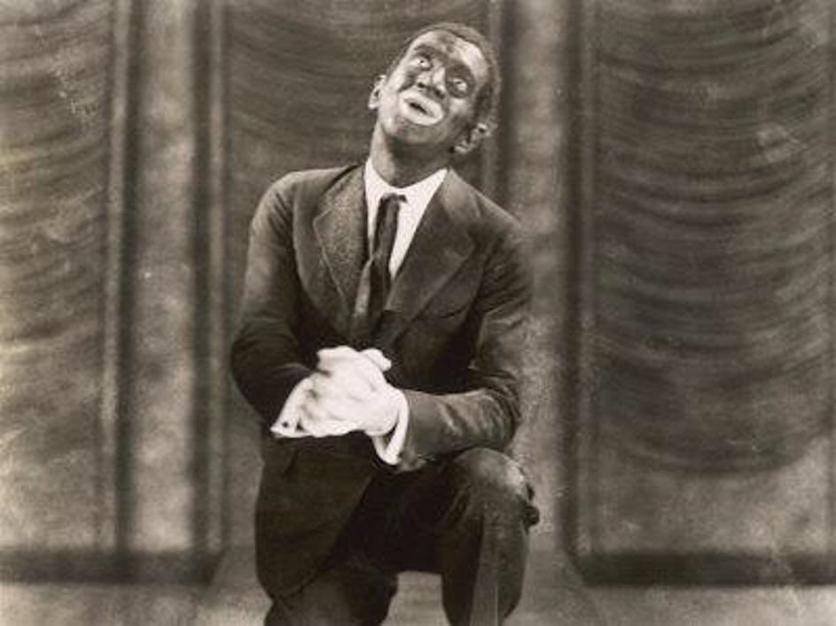 Al Jolson portraying Jack Robin singing in blackface