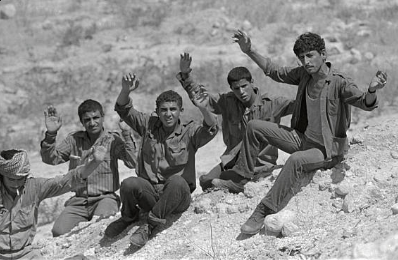 A group of fedayeen surrendering to an Israeli border patrol after having fled across the Jordan River, 21 July 1971.
