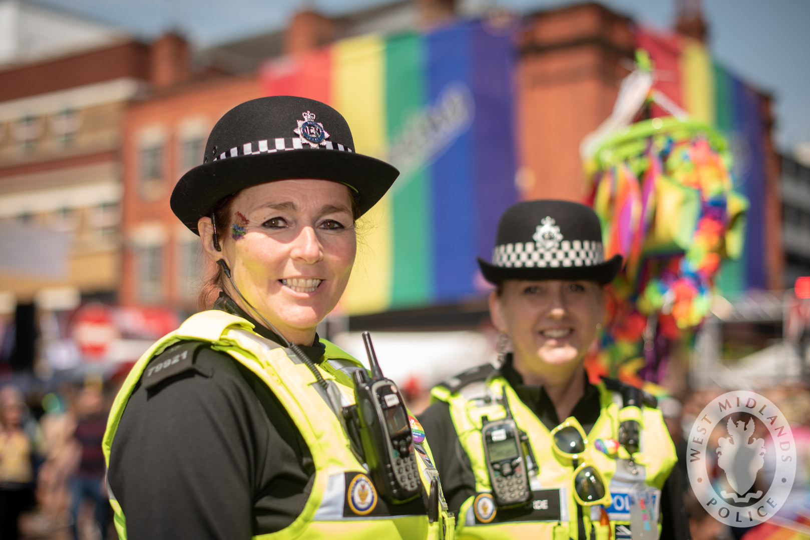 Two police women at a gay pride celebration.