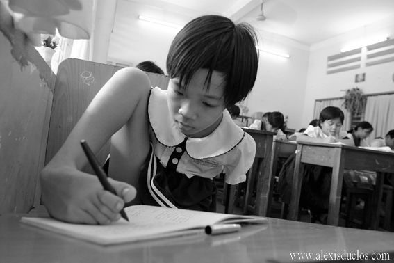 File:A vietnamese young girl writes in her schoolbook.jpg