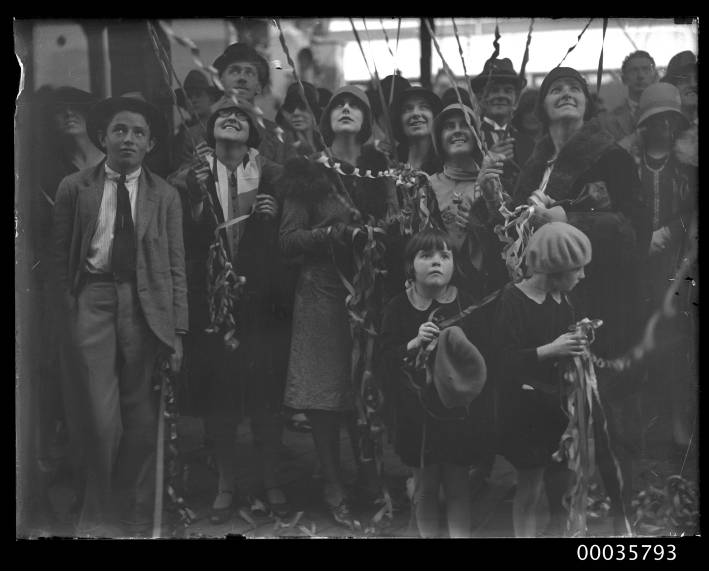 File:Crowd of people looking upwards with streamers at arrival or departure of SS ORUNGAL, c 1927 (8089201359).jpg