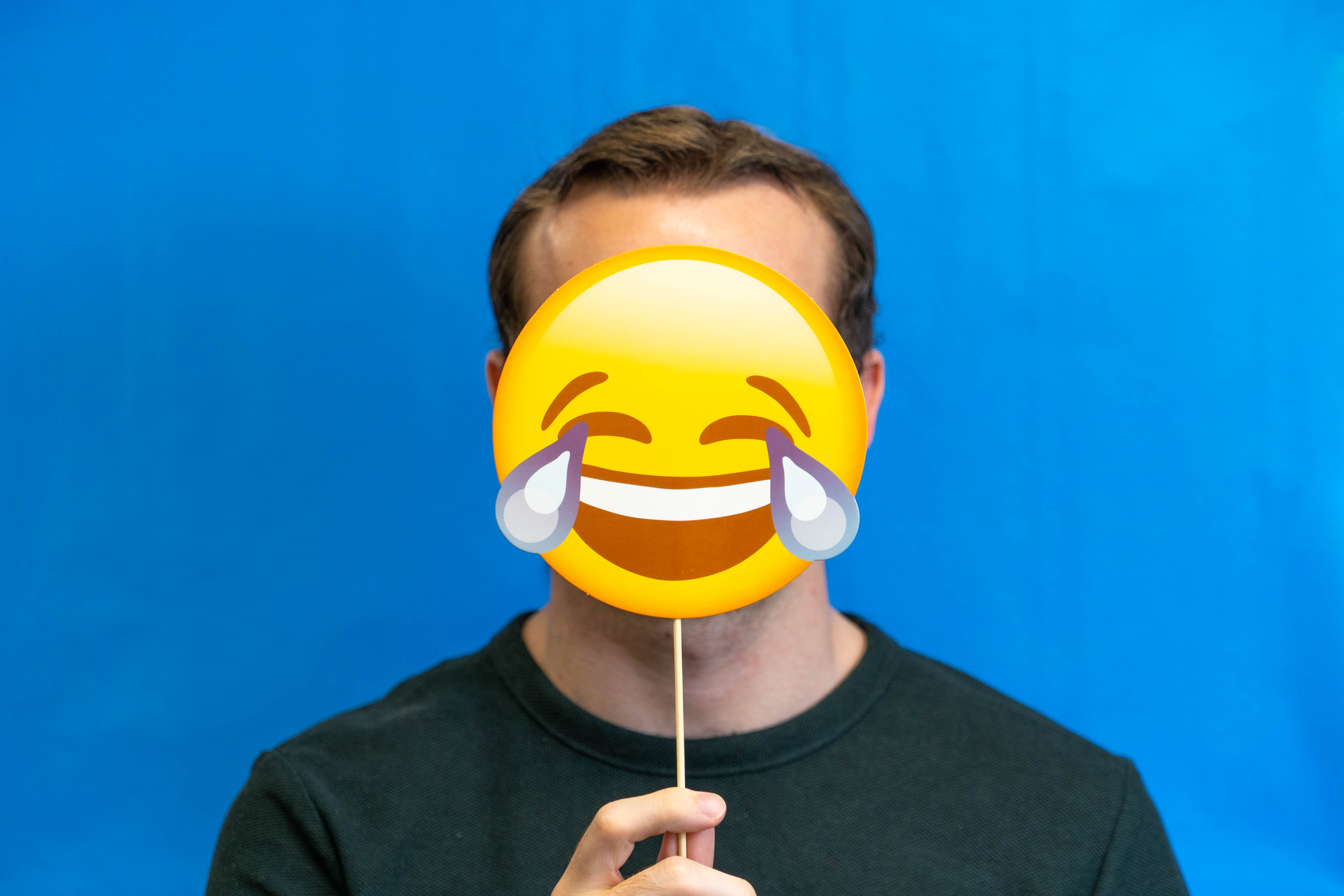 File:Man a laughing emoji mask.jpg - Wikimedia Commons