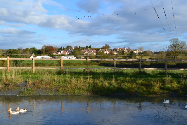 File:Houses at Bibstone seen across the pond at Townwell (geograph 5591388).jpg