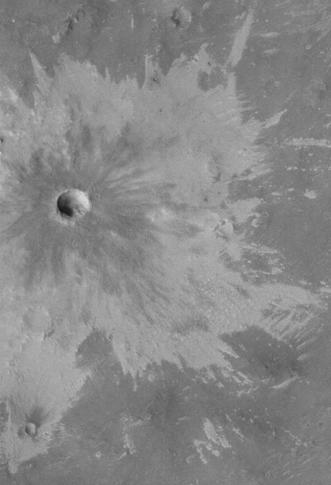 Bright rays caused by impact throwing out a bright lower layer. Some bright layers contain hydrated minerals. Picture taken with Mars Global Surveyor, under the MOC Public Targeting Program.