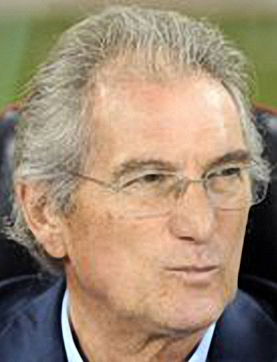 Cairo's head coach Manuel Jose sist on the coach's bench during