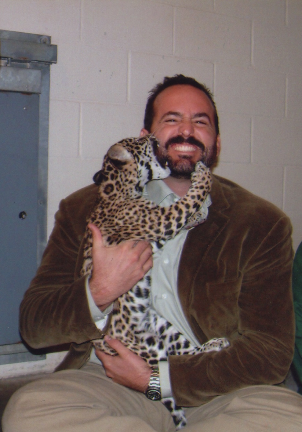 Greive posing with a jaguar cub