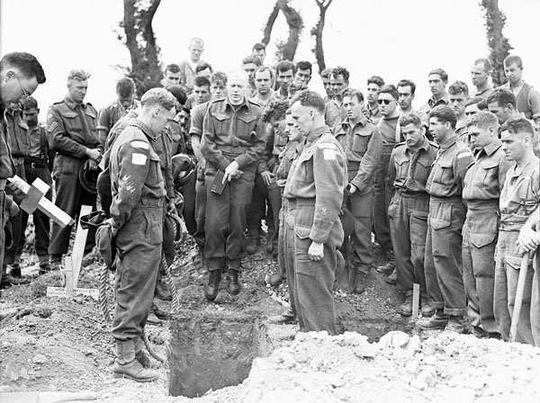 H_Captain_Callum_Thompson%2C_a_Canadian_chaplain%2C_conducting_a_funeral_service_in_the_Normandy_bridgehead%2C_France%2C_16_July_1944.jpg