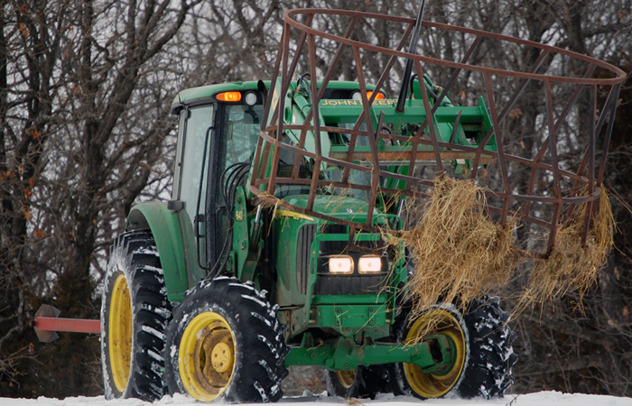 File:John Deere tractor with cattle feeder.jpg