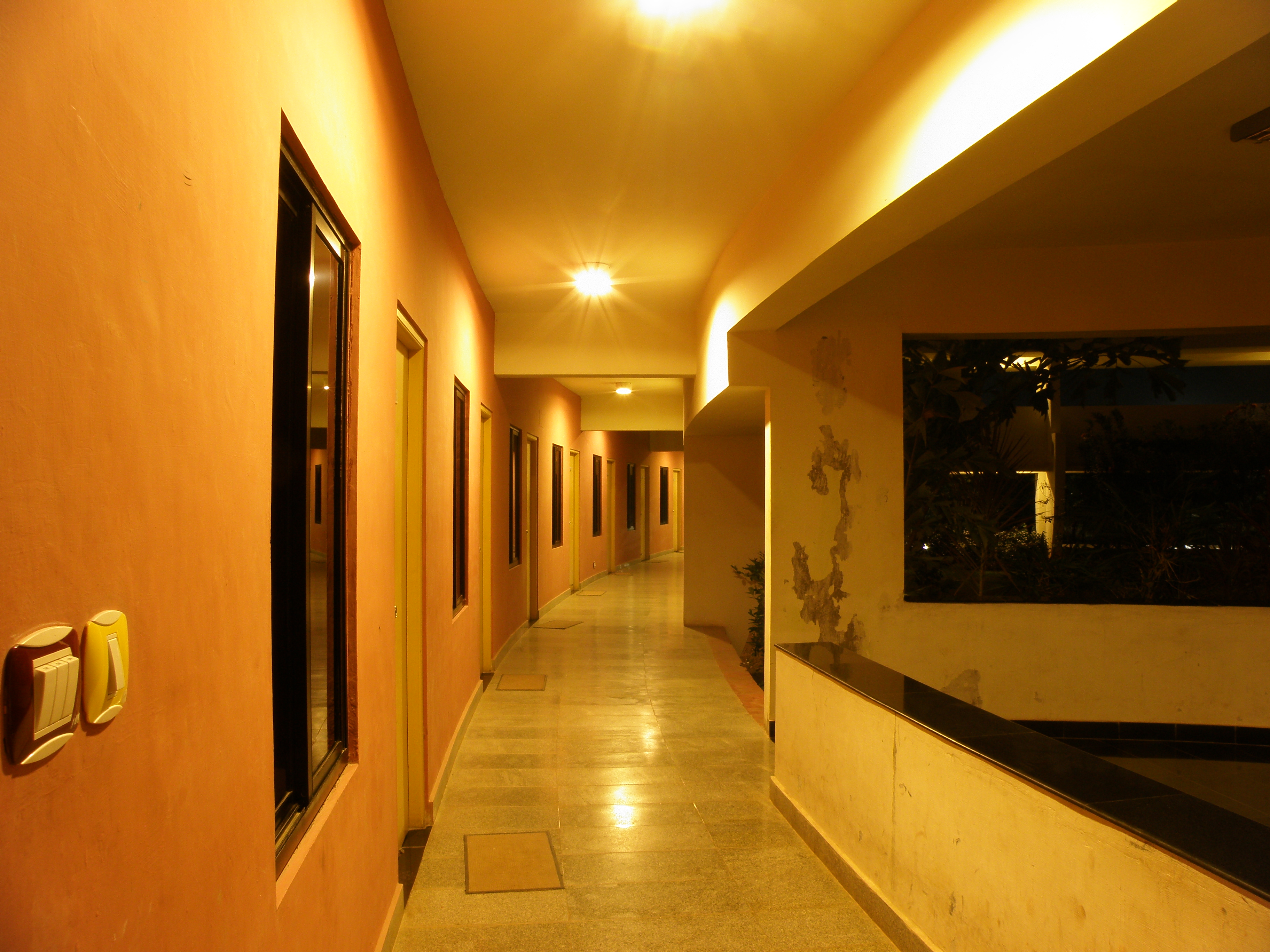 Chennai_Mathematical_Institute_main_building_curved_corridor_with_office_doors_at_night