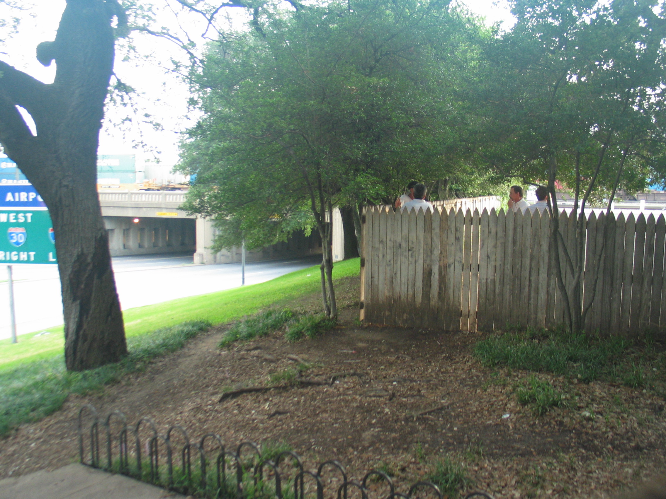 The wooden fence on the grassy knoll, where many conspiracy theorists belie...