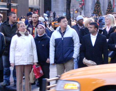 People waiting to cross Fifth Avenue