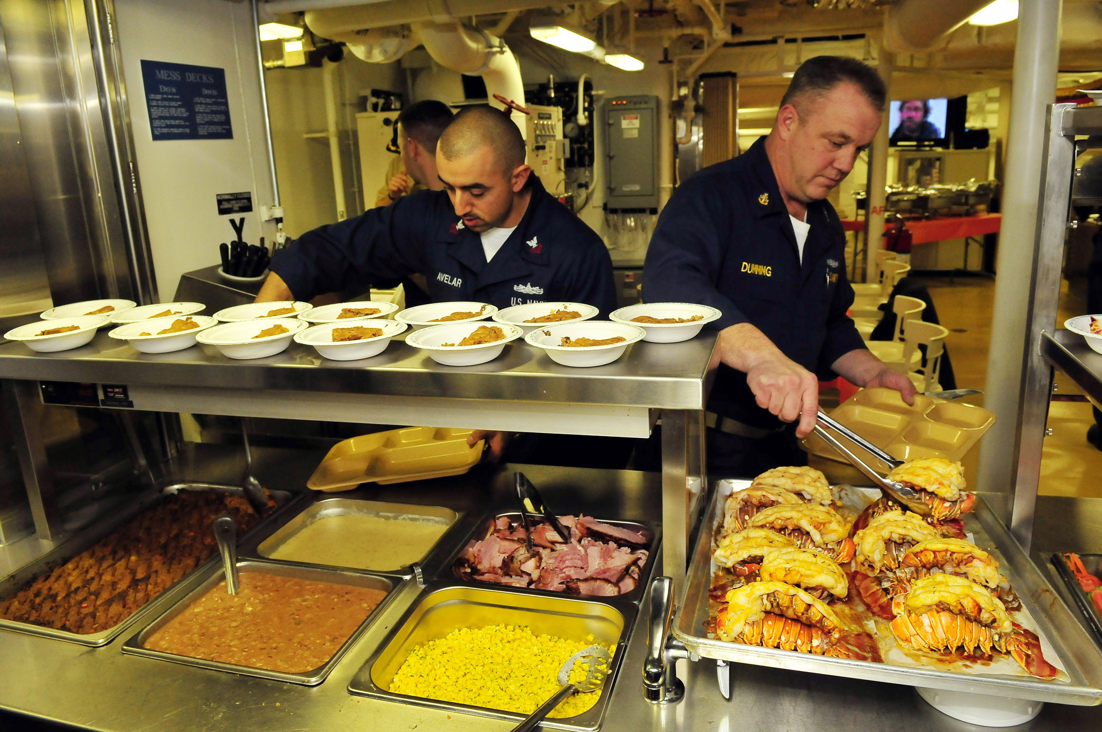 US_Navy_081127-N-5758H-639_Mineman_1st_Class_Jose_Avelar_and_Senior_Chief_Operations_Specialist_Thomas_Dunning_make_their_Thanksgiving_dinner_plates.jpg