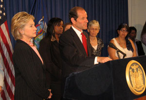 New York Governor Eliot Spitzer and Senator Clinton talk about health care coverage in August 2007.