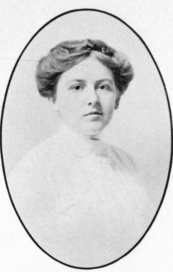 A small formal portrait photograph of Douglas in her early twenties. She has a round face, short nose and dark intelligent eyes. Her dark hair is parted in the middle and piled on her head.