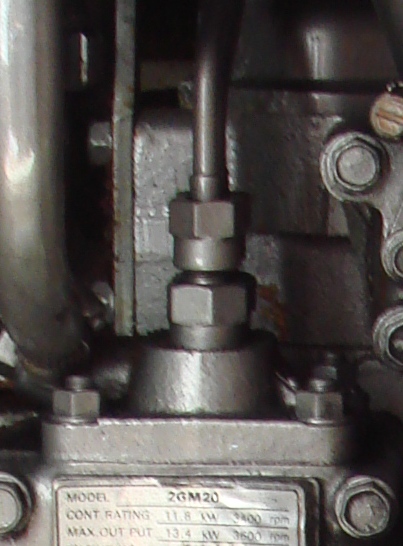 A high-pressure fuel pump on a Yanmar 2GM20 marine diesel engine