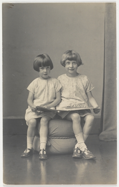 Elizabeth Jolley and (younger) sister Madelaine Winifred reading, ca. 1927