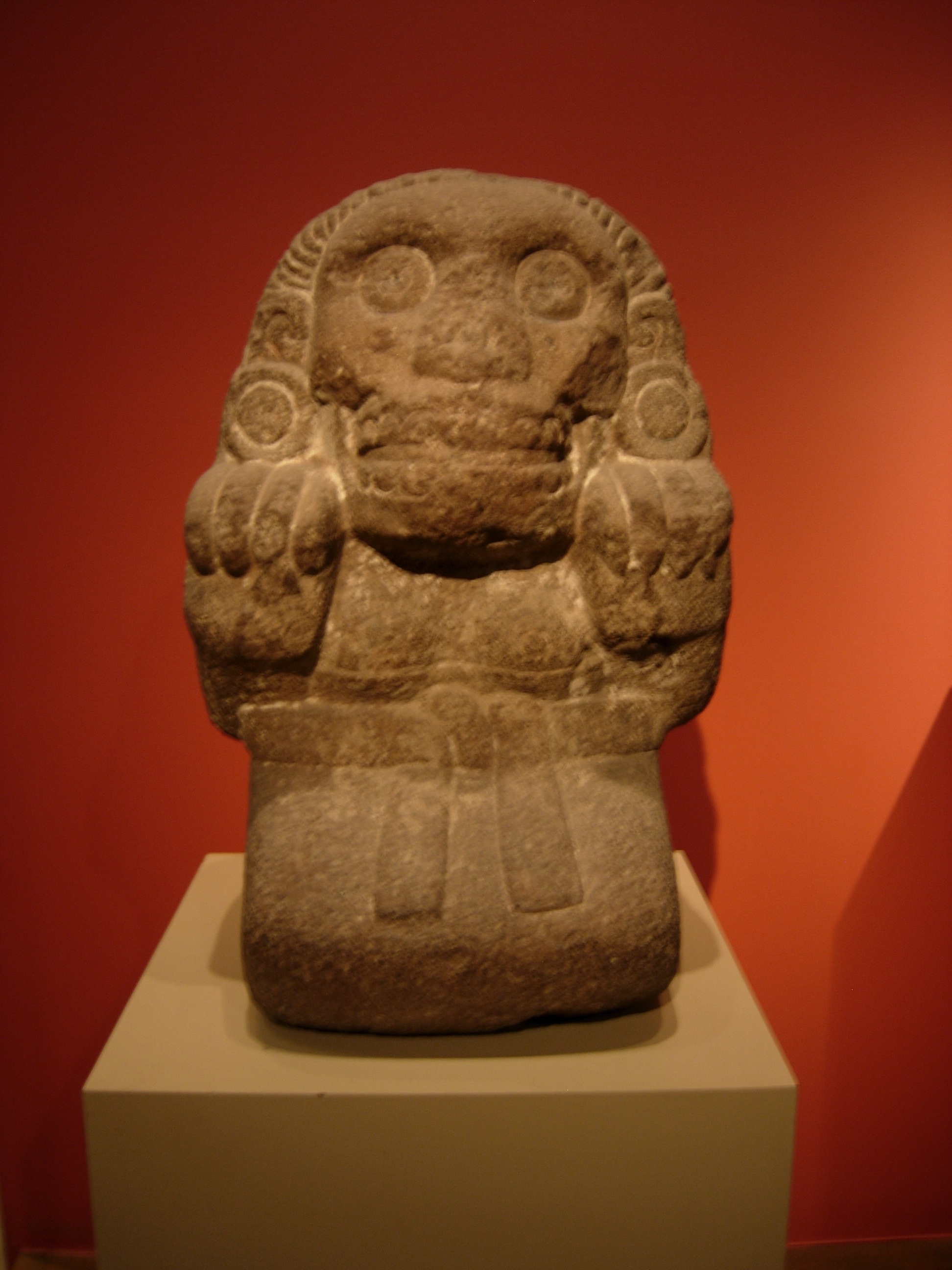An Aztec sculpture of the Cihuateteo, a face suggestive of a skull and talons for hands