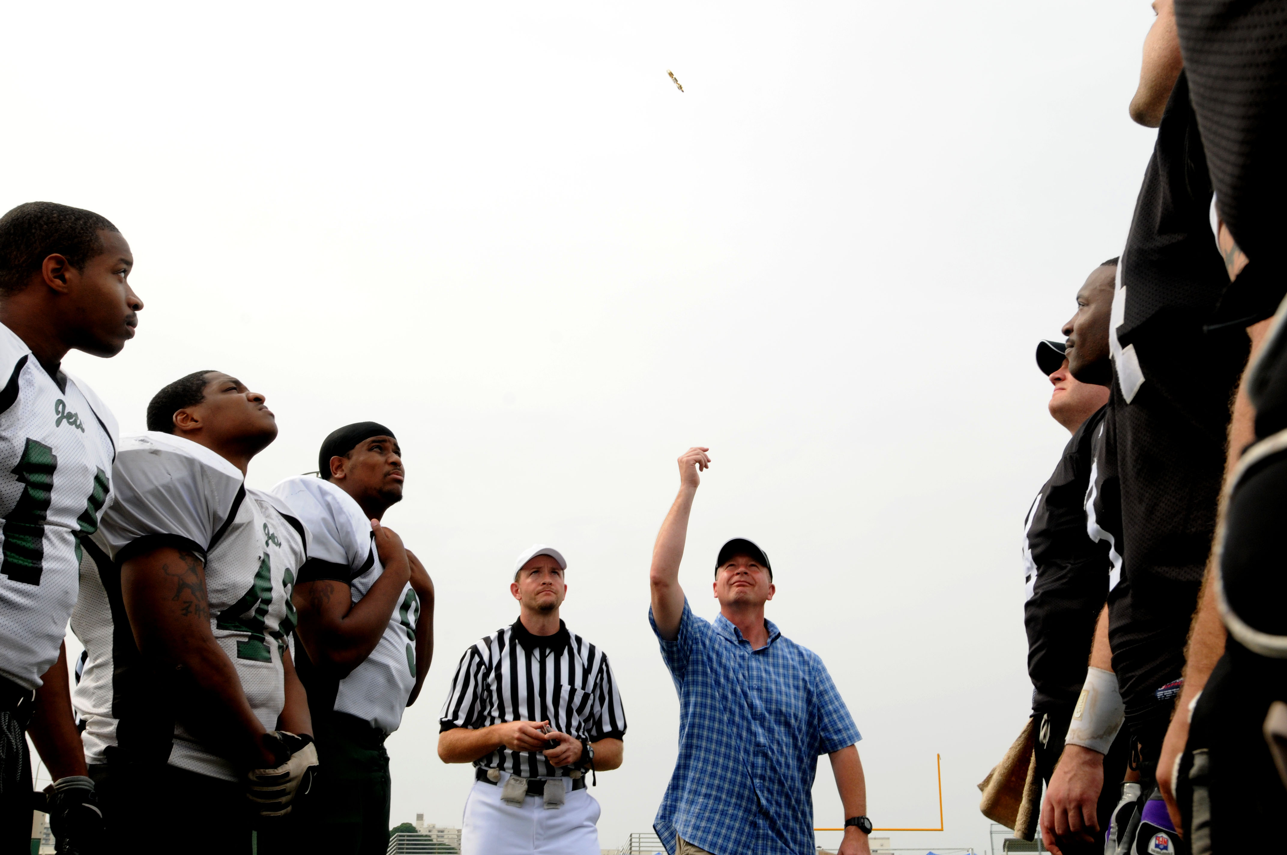 US Navy 090704-N-9818V-494 Master Chief Petty Officer of the Navy (MCPON) Rick West tosses the coin for the Yokosuka Seahawks and Misawa Jets