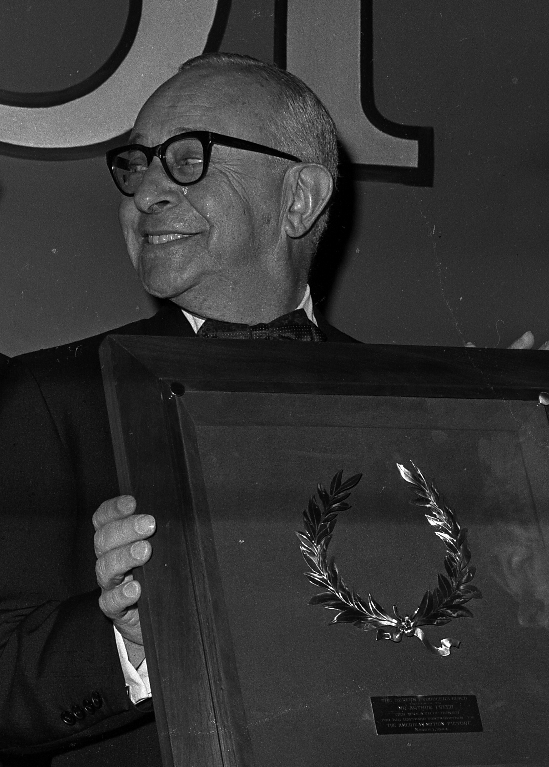Freed receiving the Screen Producers Guild's Milestone Award, 1964