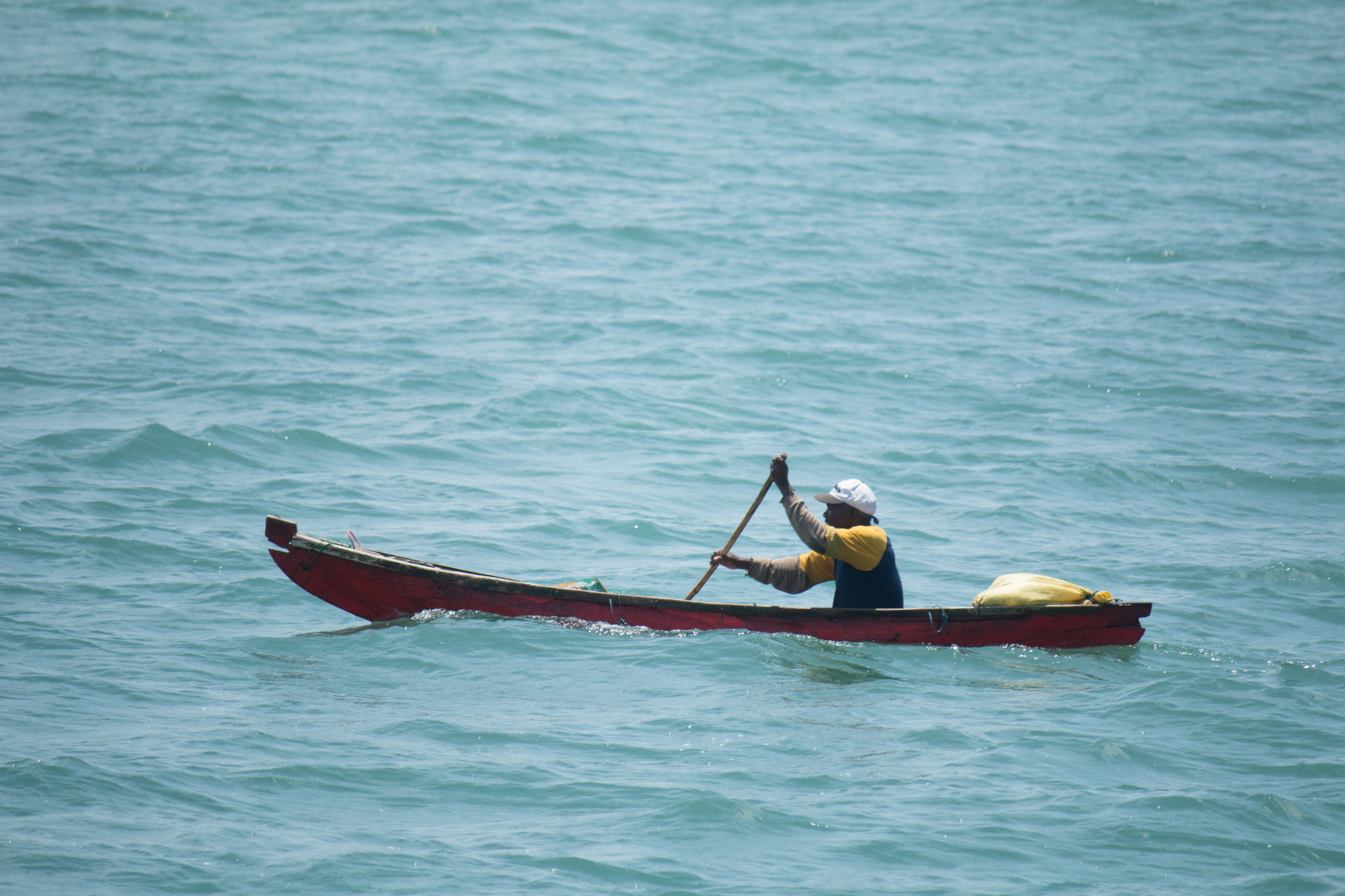 File:Fishing boat and the fisherman.jpg - Wikimedia Commons