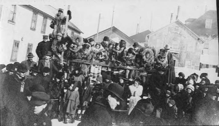 File:Crowd at an event, some wearing fur parkas, with US Life Saving Station visible in background, Nome, Alaska, between 1906 and (AL+CA 7673).jpg